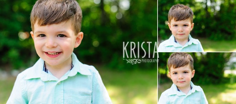 adorable toddler boy in green shirt standing among green trees during springtime mini portrait session in New England