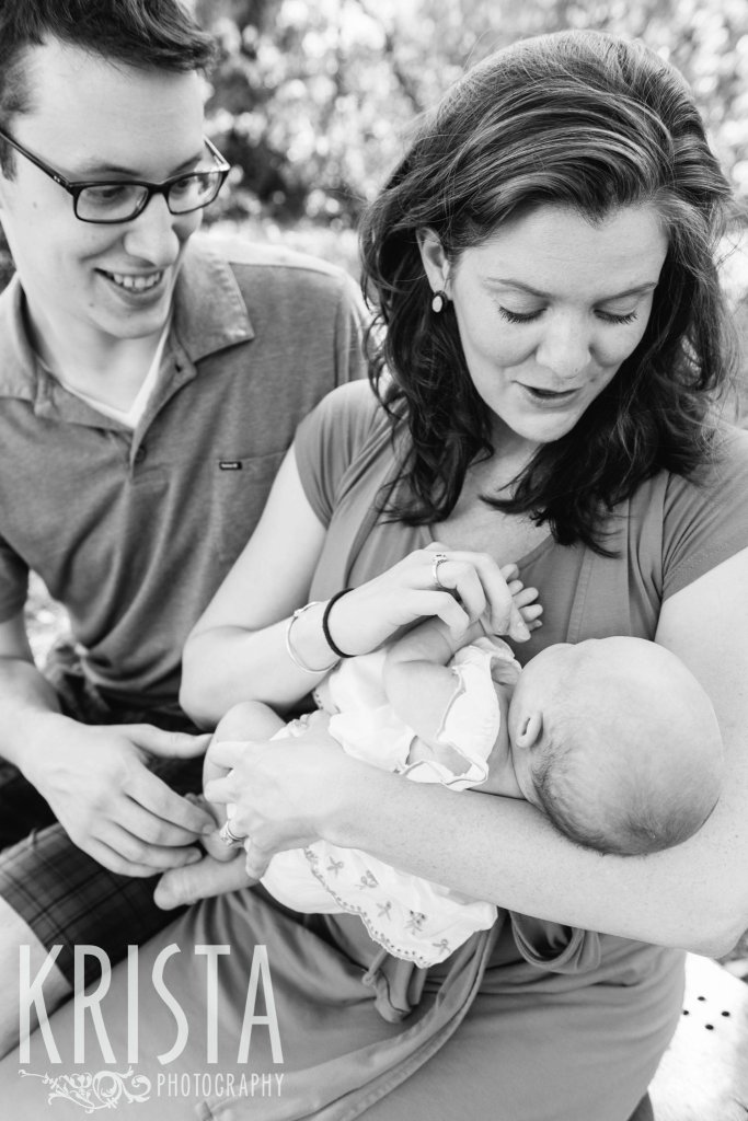 black and white image of new parents and infant baby girl 