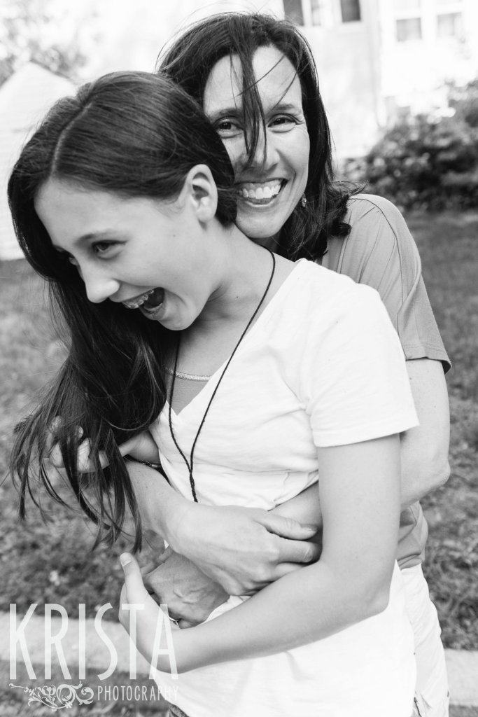 mother and teenage daughter laughing during spring mini portrait session