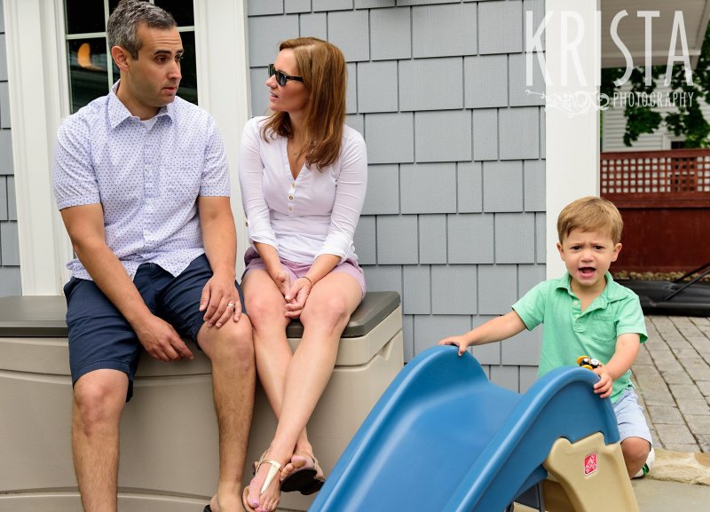 family hanging out on back steps during lifestyle portrait session at home