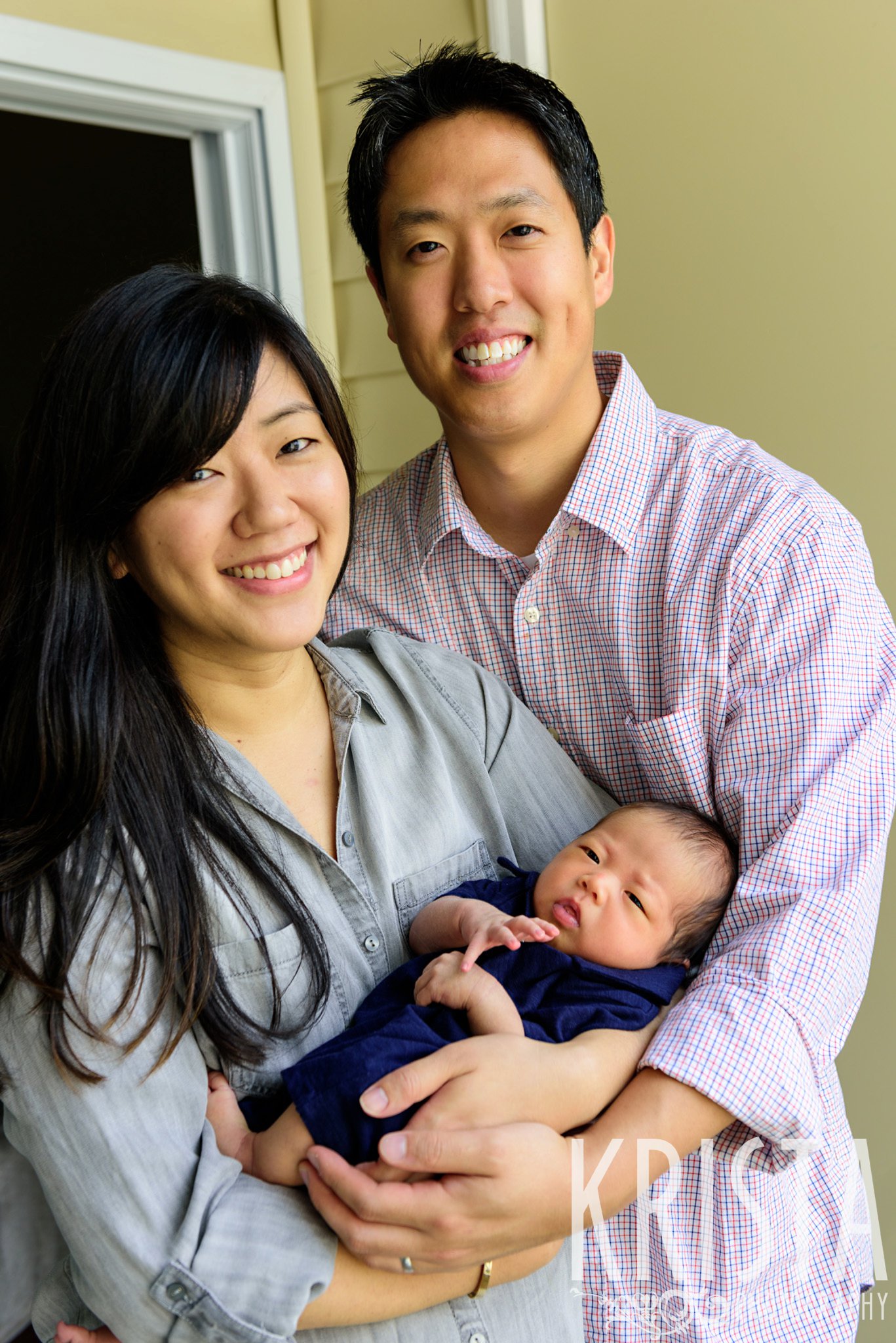 adorable Asian family with newborn baby boy