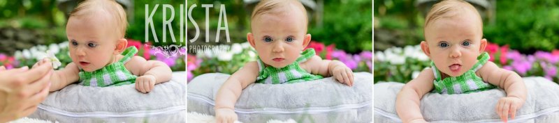 adorable three month old baby girl laying on belly on pillow in green gingham sundress outside in yard during lifestyle portrait session 