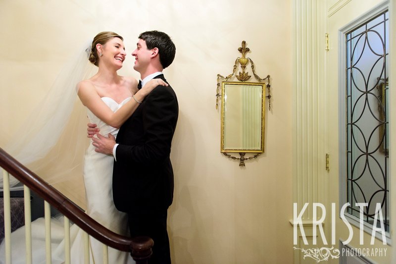 Totally natural First Look as Bride comes down the stairs to meet her Groom. Getting Ready and Bride & Groom portraits on Beacon Hill, ceremony at Harvard Memorial Church, and reception at the Harvard Art Museums. Photo by Krista Photography, Boston Wedding Photographers