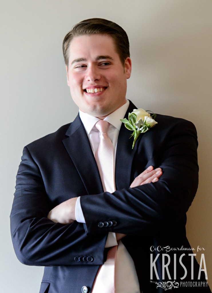 Groom smiling and posing. © 2016 Krista Photography - www.kristaphoto.com