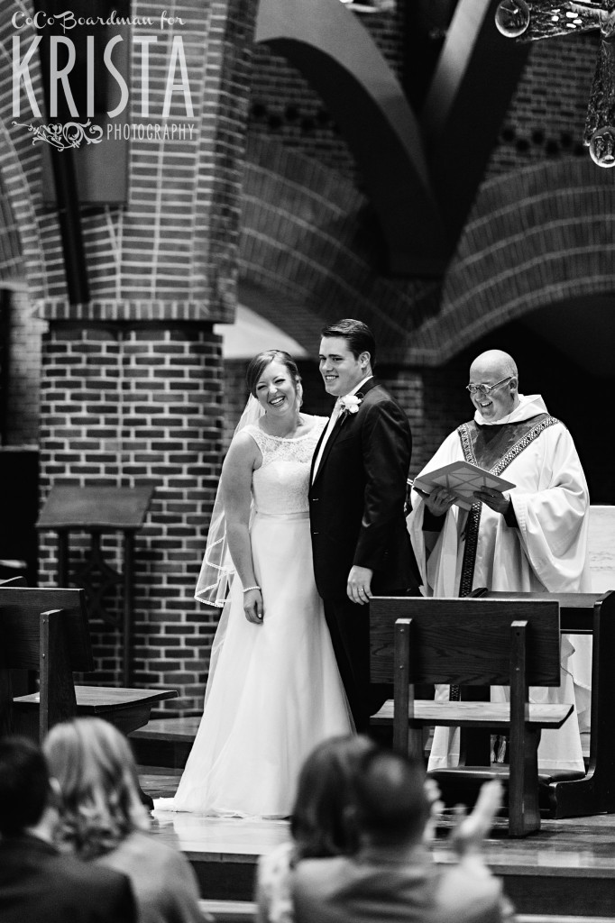 Bride and groom smiling away at the altar. © 2016 Krista Photography - www.kristaphoto.com