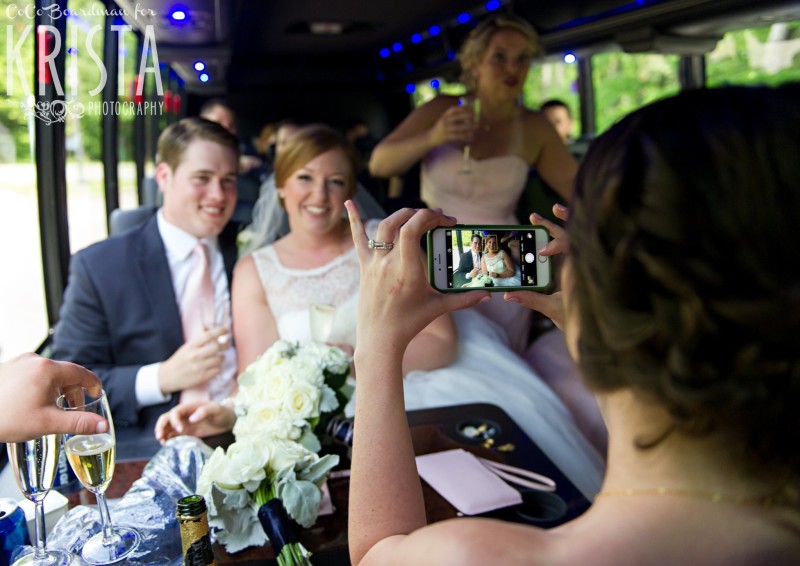 Catching the bride and groom on the party bus. © 2016 Krista Photography - www.kristaphoto.com
