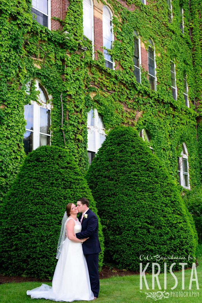 Bride and groom kissing under lush foliage. © 2016 Krista Photography - www.kristaphoto.com