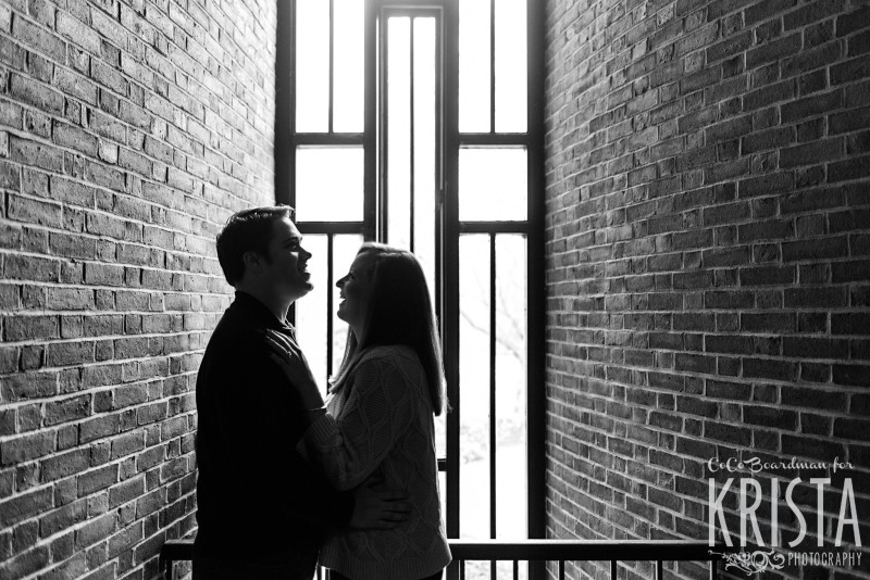 tucked away and snuggling together at St. Anselm college - Saint Anselm Engagement