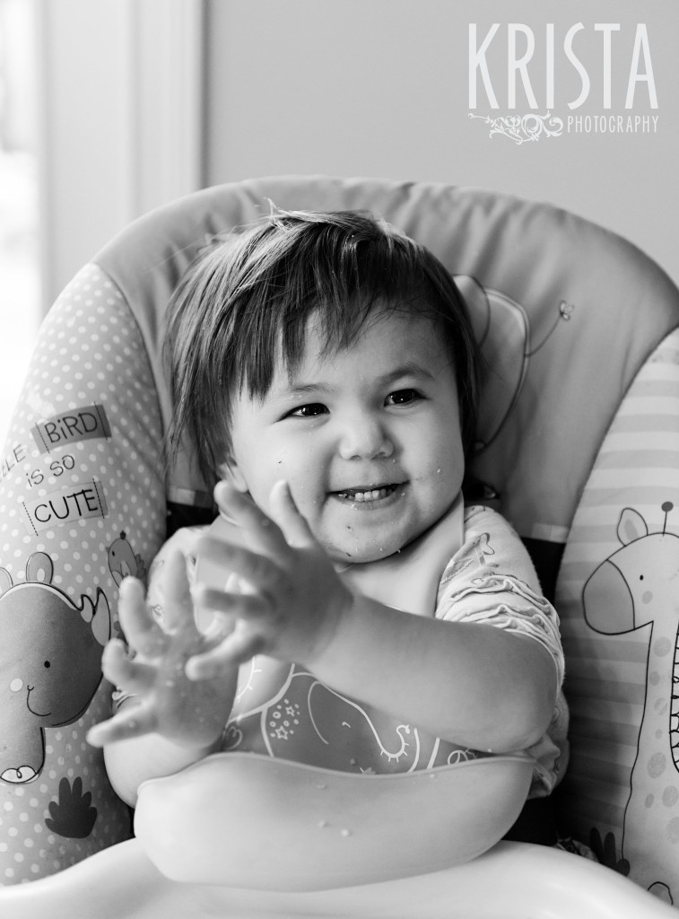 Clapping hands in high chair. 18-Month Portrait Session for family of 3 in Indianapolis, IN - © Krista Guenin | Krista Photography - www.kristaphoto.com